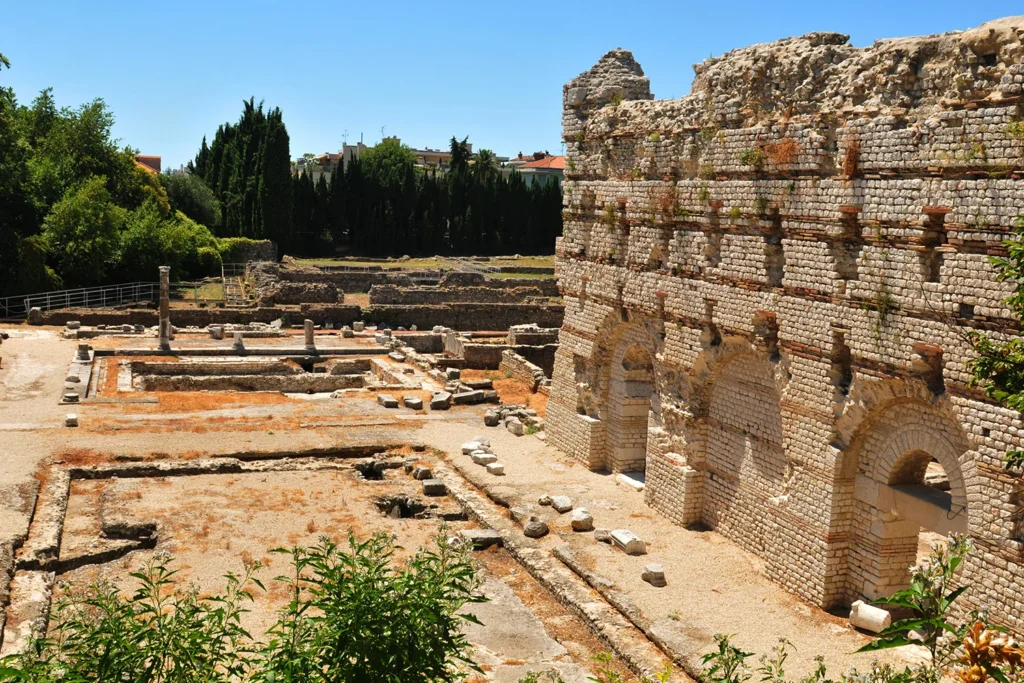 The Roman arena ruins and ancient city structures are located in the Cimiez district, Nice.