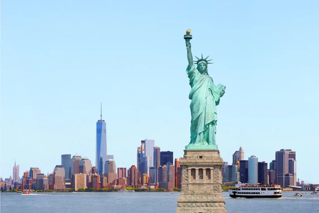 The Statue of Liberty on the horizon of New York City.