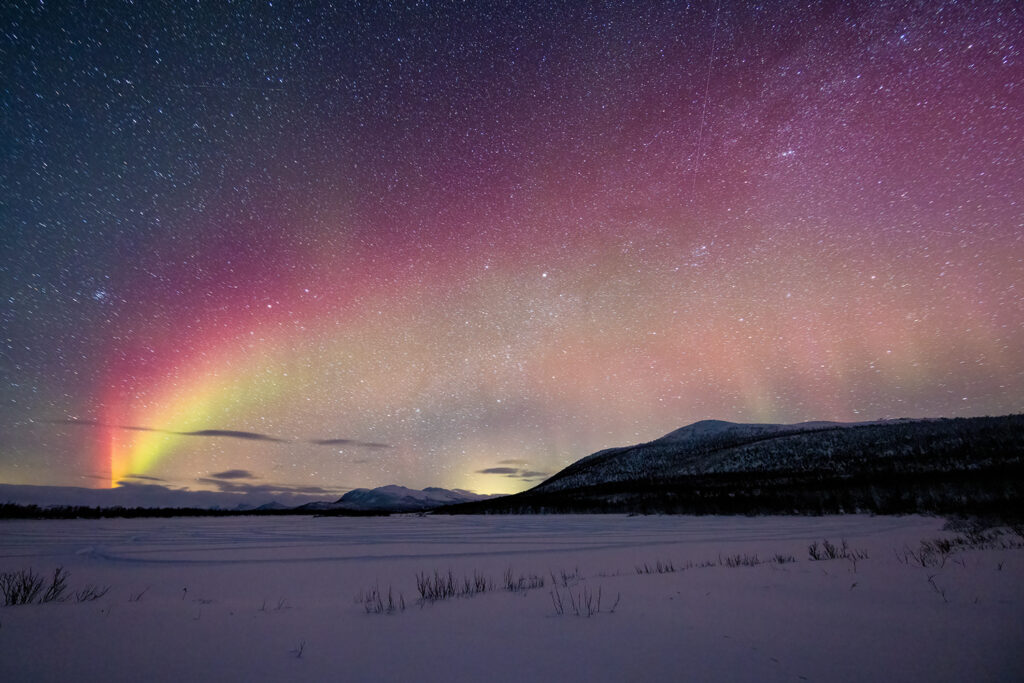 A trip through Lapland offers a great chance to witness the Northern Lights firsthand. Pictured: the aurora over the village of Enontekiö.