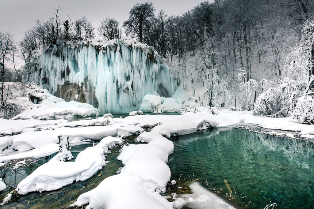 Snow-covered areas of Plitvice Lakes National Park in winter.